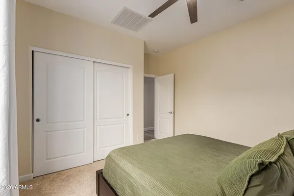 a bedroom with a bed and a cabinets
