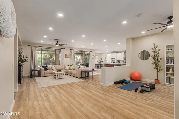 a living room with furniture and white walls