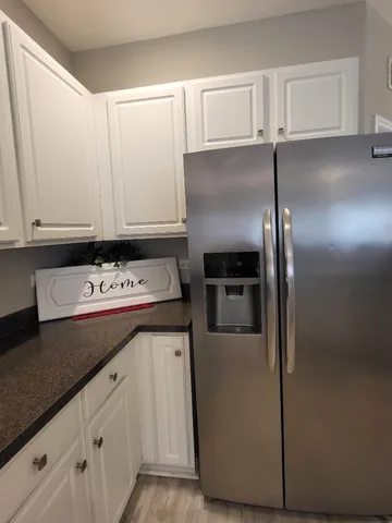 a kitchen with stainless steel appliances a stove sink microwave and cabinets