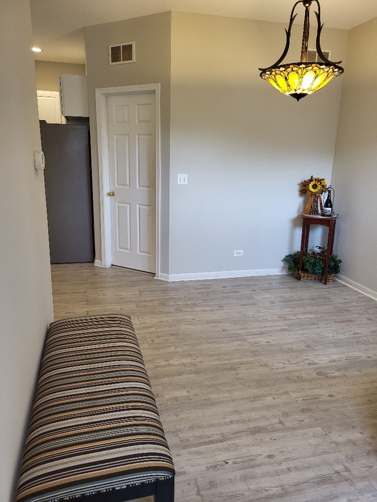 2949 Brossman Street Naperville, IL 60564 - Photo 20 of 61 a view of a room with wooden floor and a ceiling fan