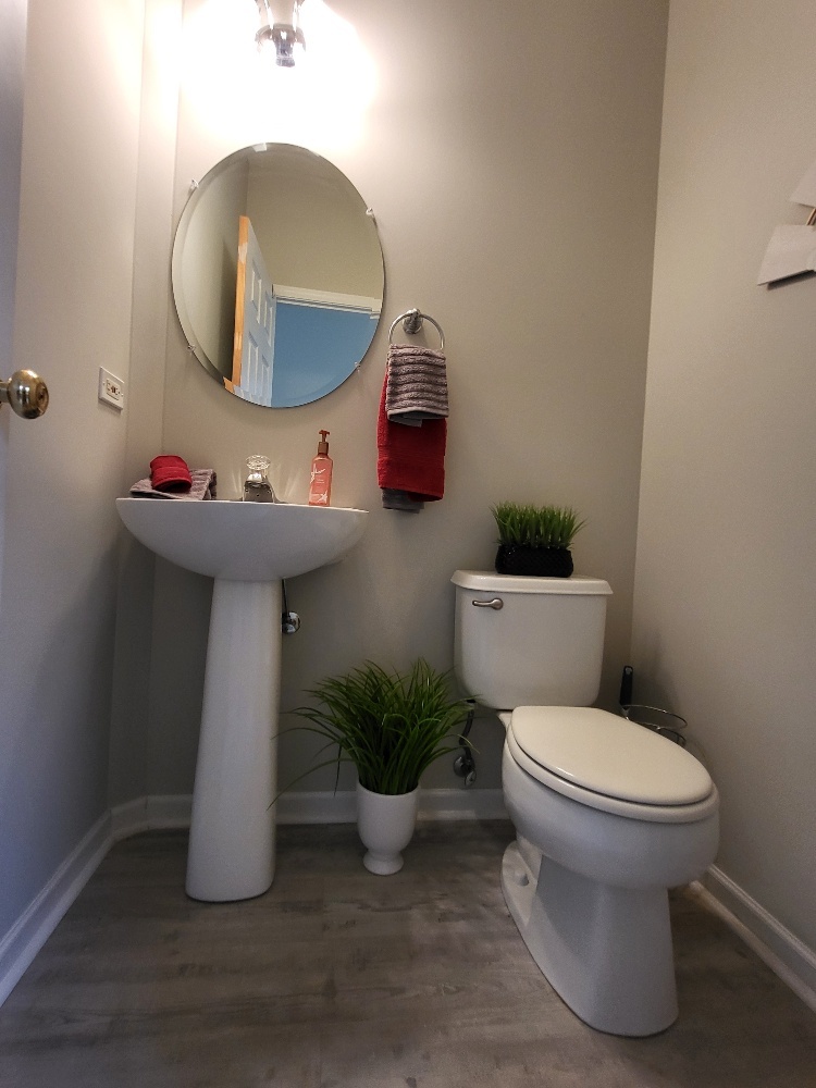 2949 Brossman Street Naperville, IL 60564 - Photo 22 of 61 a bathroom with a toilet sink and mirror