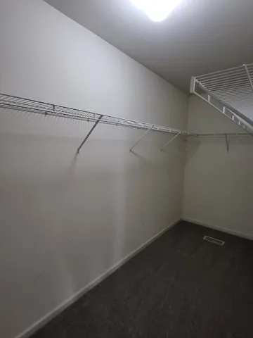 a bathroom with a glass door shower and a sink