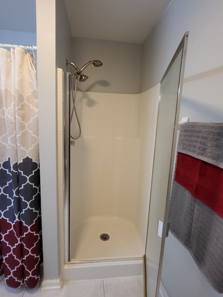 2949 Brossman Street Naperville, IL 60564 - Photo 33 of 61 a bathroom with a glass door shower and a sink