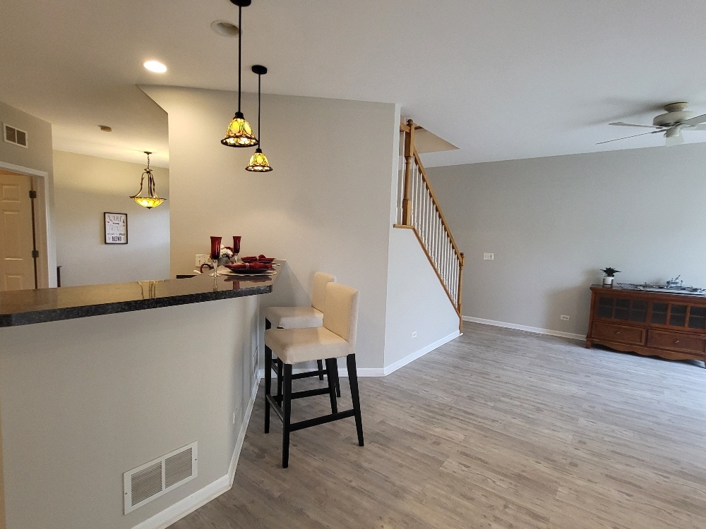 2949 Brossman Street Naperville, IL 60564 - Photo 10 of 61 a view of a dining room with furniture and wooden floor