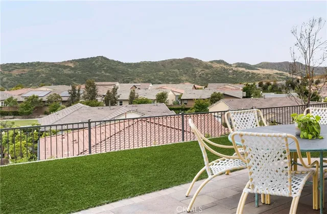 a view of a terrace with a lake view