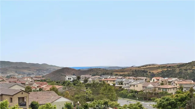 an aerial view of residential houses and city view