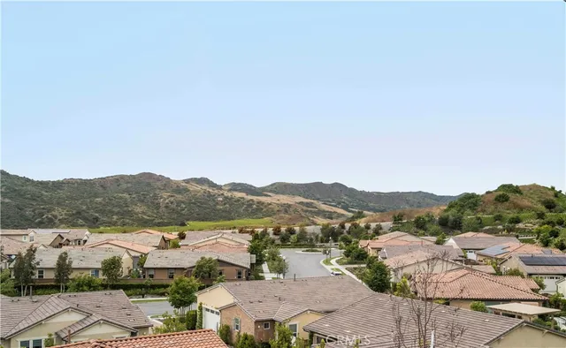 a view of a town with mountains in the background