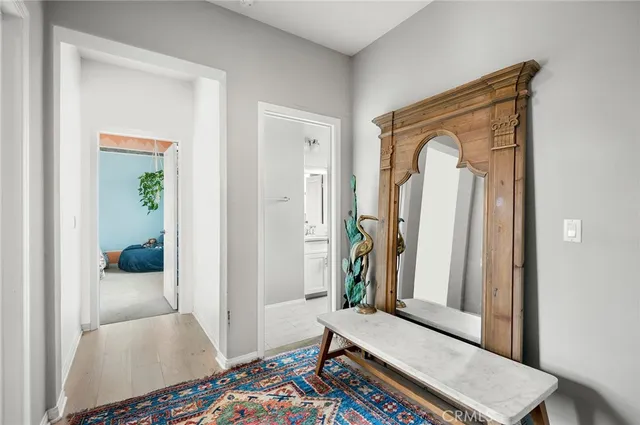 a bedroom with a bed window and a table