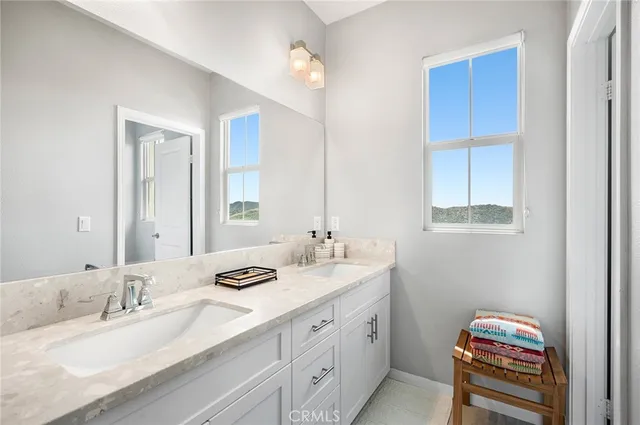 a bedroom with a bed and a potted plant