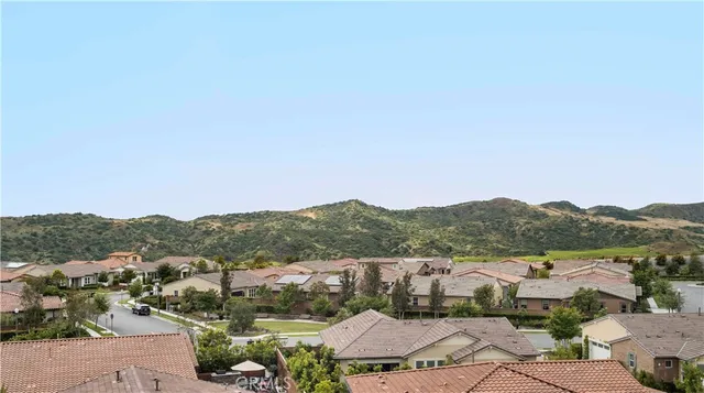 an aerial view of residential house with outdoor space and trees