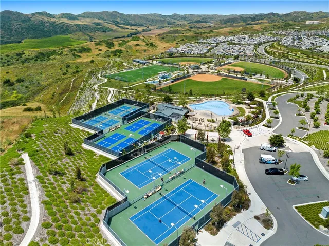 an aerial view of residential houses with outdoor space