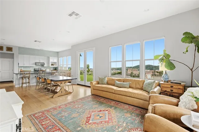 a living room with furniture dining area and a table