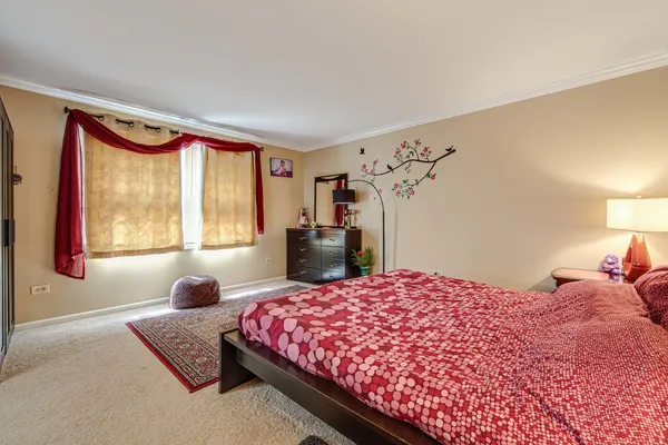 a bedroom with a bed and window