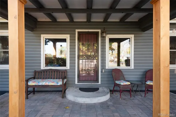 a outdoor living space with furniture and a potted plant