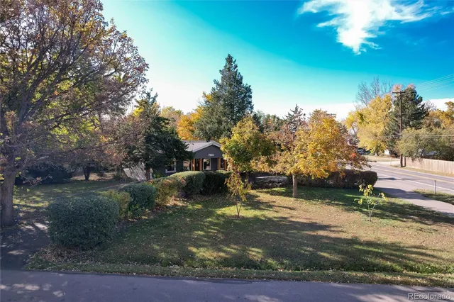 an aerial view of residential building and trees