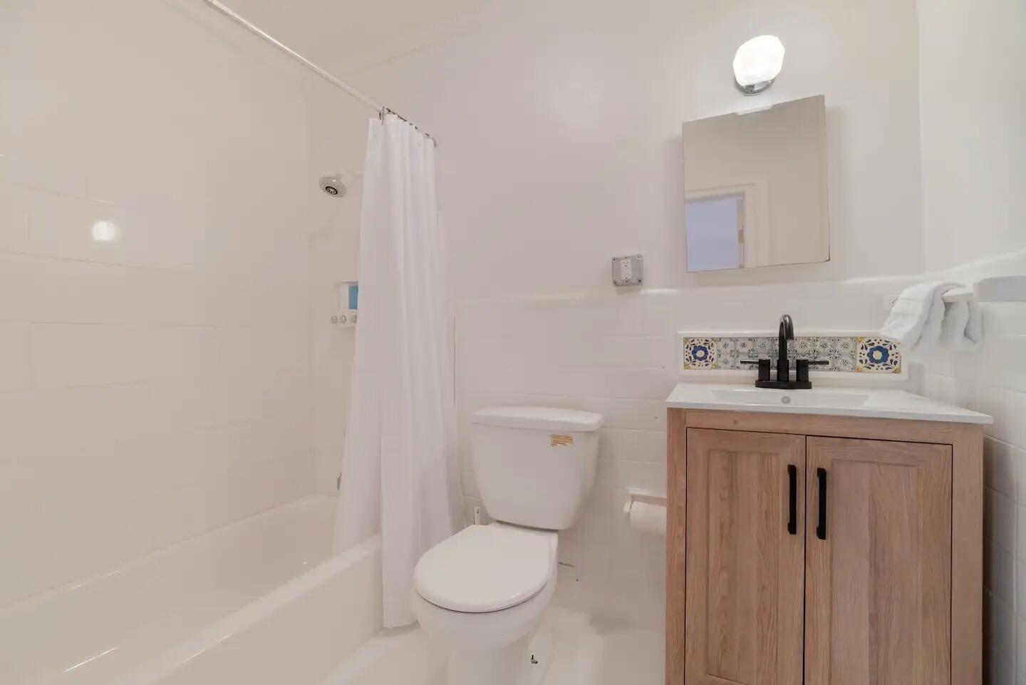 321 Malverne Road West Palm Beach, FL 33405 - Photo 15 of 17 a bathroom with a sink a toilet and shower