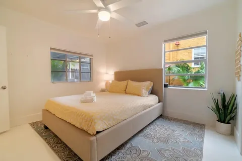 a bedroom with a bed and window