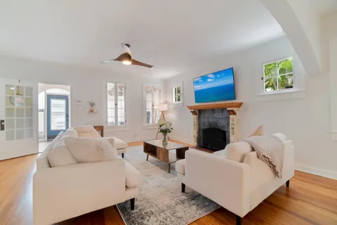 a living room with furniture and a fireplace