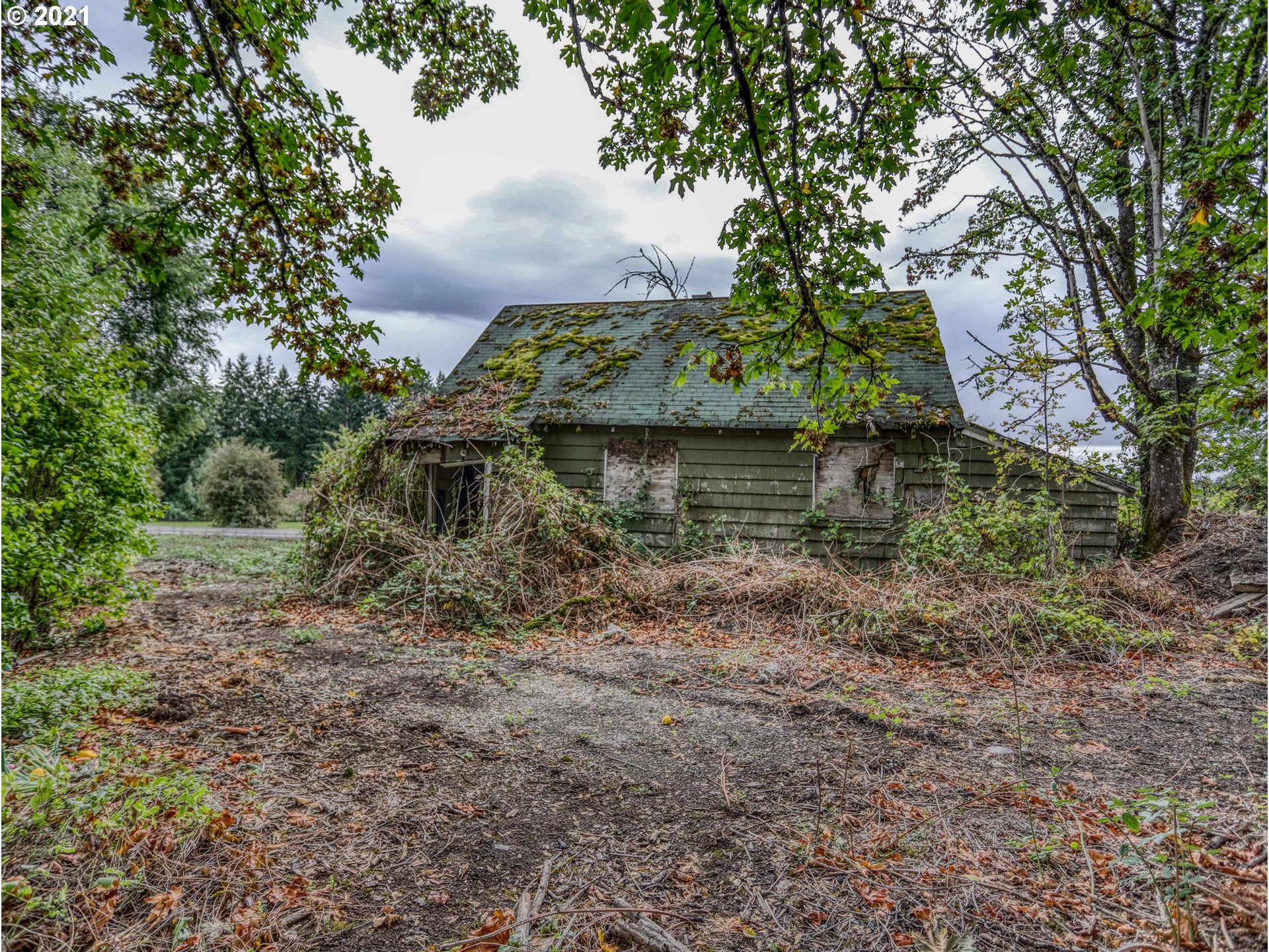30148 Southeast Bluff Road Gresham, OR 97080 - Photo 16 of 22 a view of a wooden house with a yard