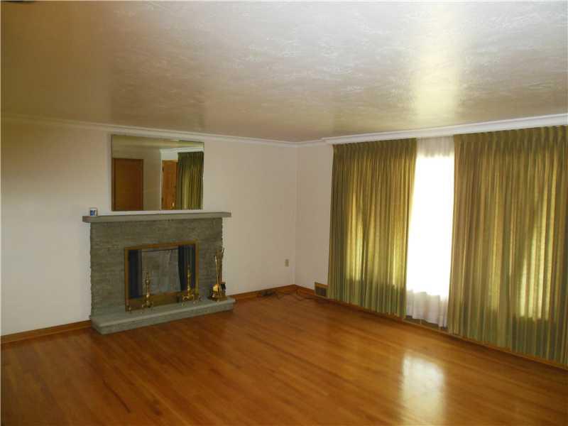 518 Agnew Road Baldwin, PA 15227 - Photo 5 of 15 Living Room. Gleaming Hardwood Floors and Fireplace