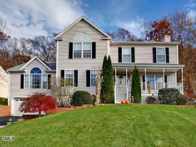 98 Lazy Brook Road Monroe, CT 06468 - Photo 1 of 1 a front view of a house with a garden and plants