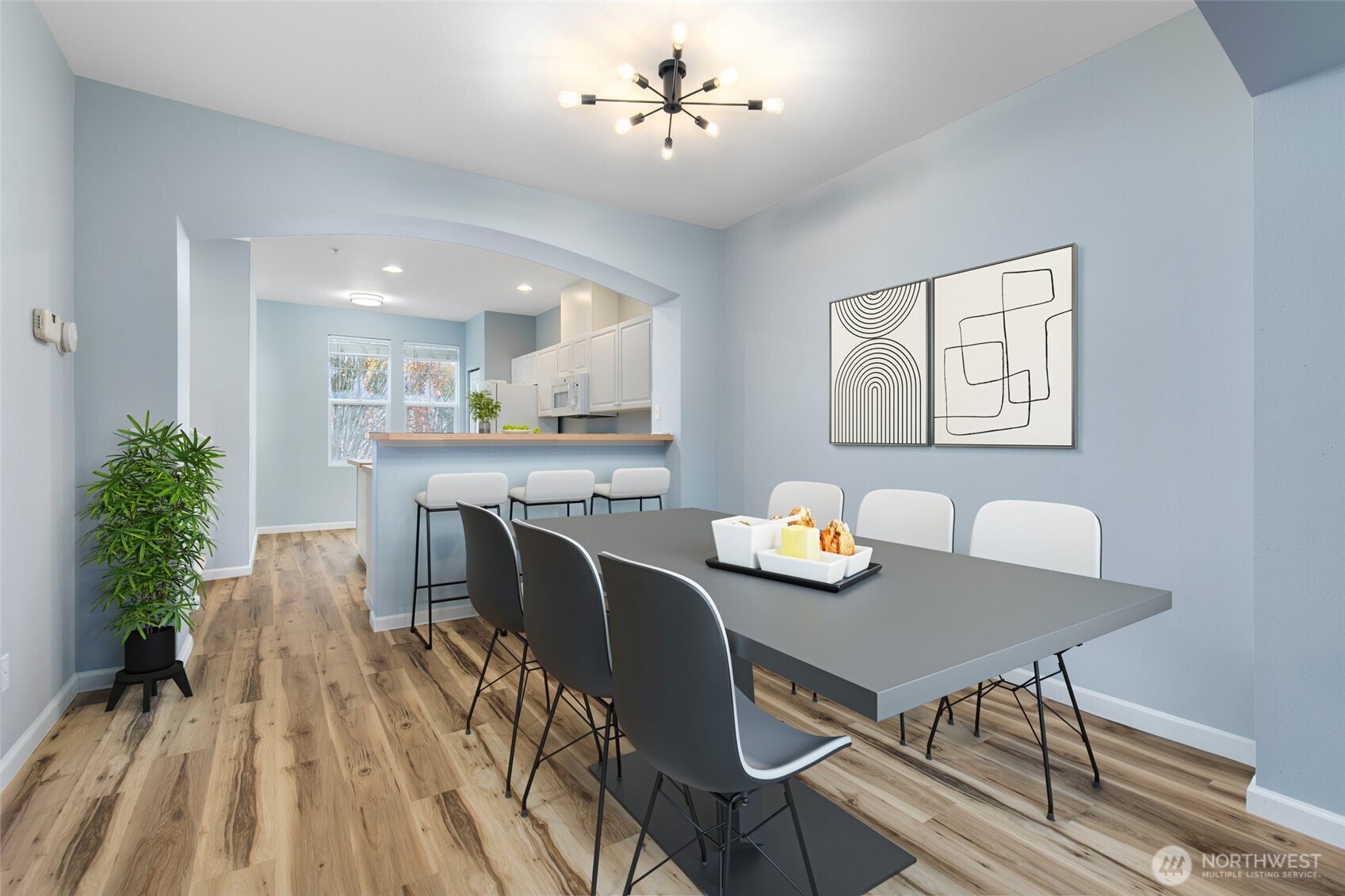 22607 42nd Place South, Unit 13 Kent, WA 98032 - Photo 3 of 19 a view of a dining room with furniture and a chandelier