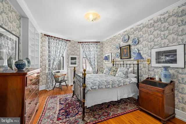 a bedroom with furniture and a bed