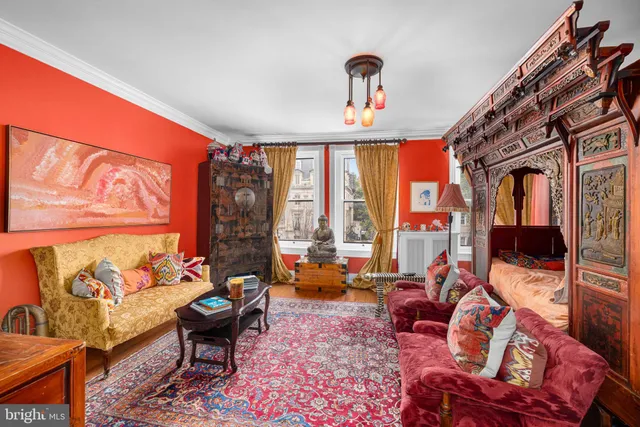 a living room with furniture or couch and a large window