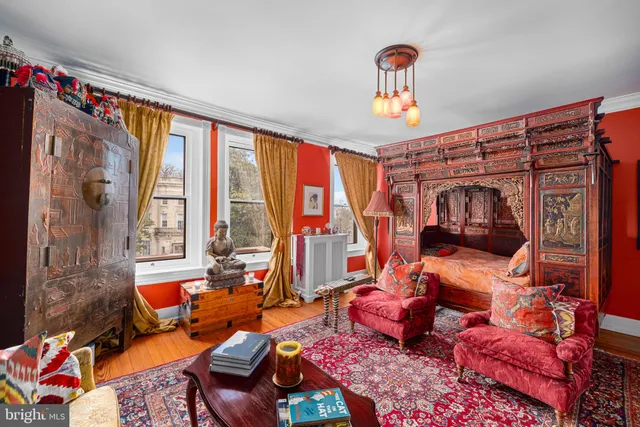 a bedroom with furniture and a window