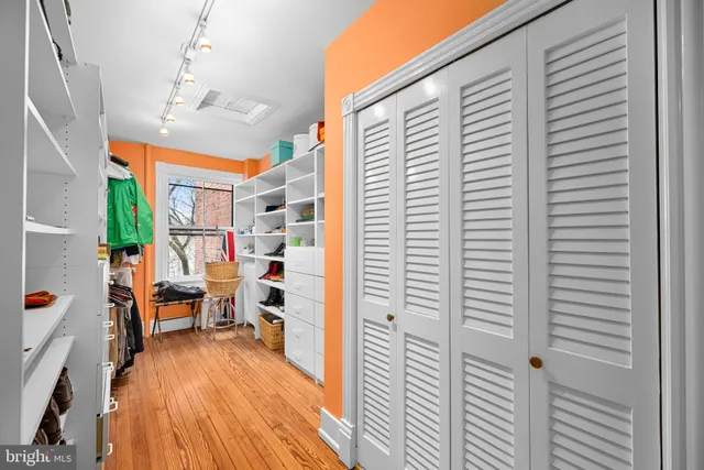 a view of a balcony with workspace and a window