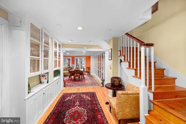 a living room with furniture and a rug