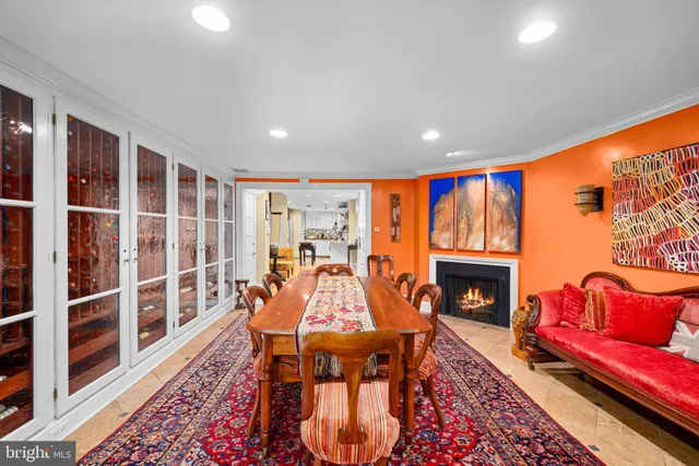 a living room with furniture a rug and a fireplace