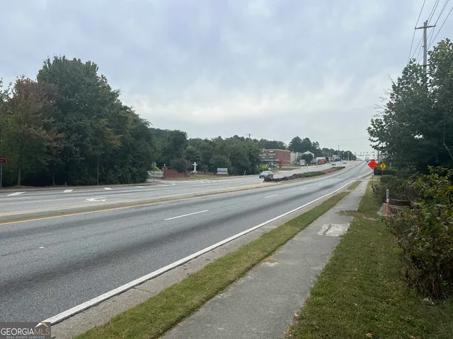 a view of a street with a houses