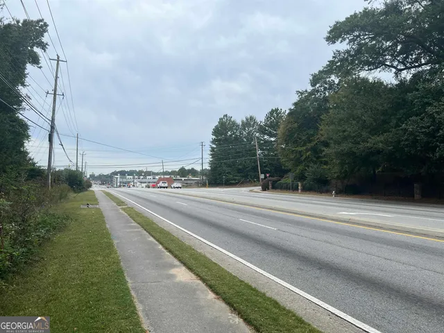 a view of a city street with a building in the background