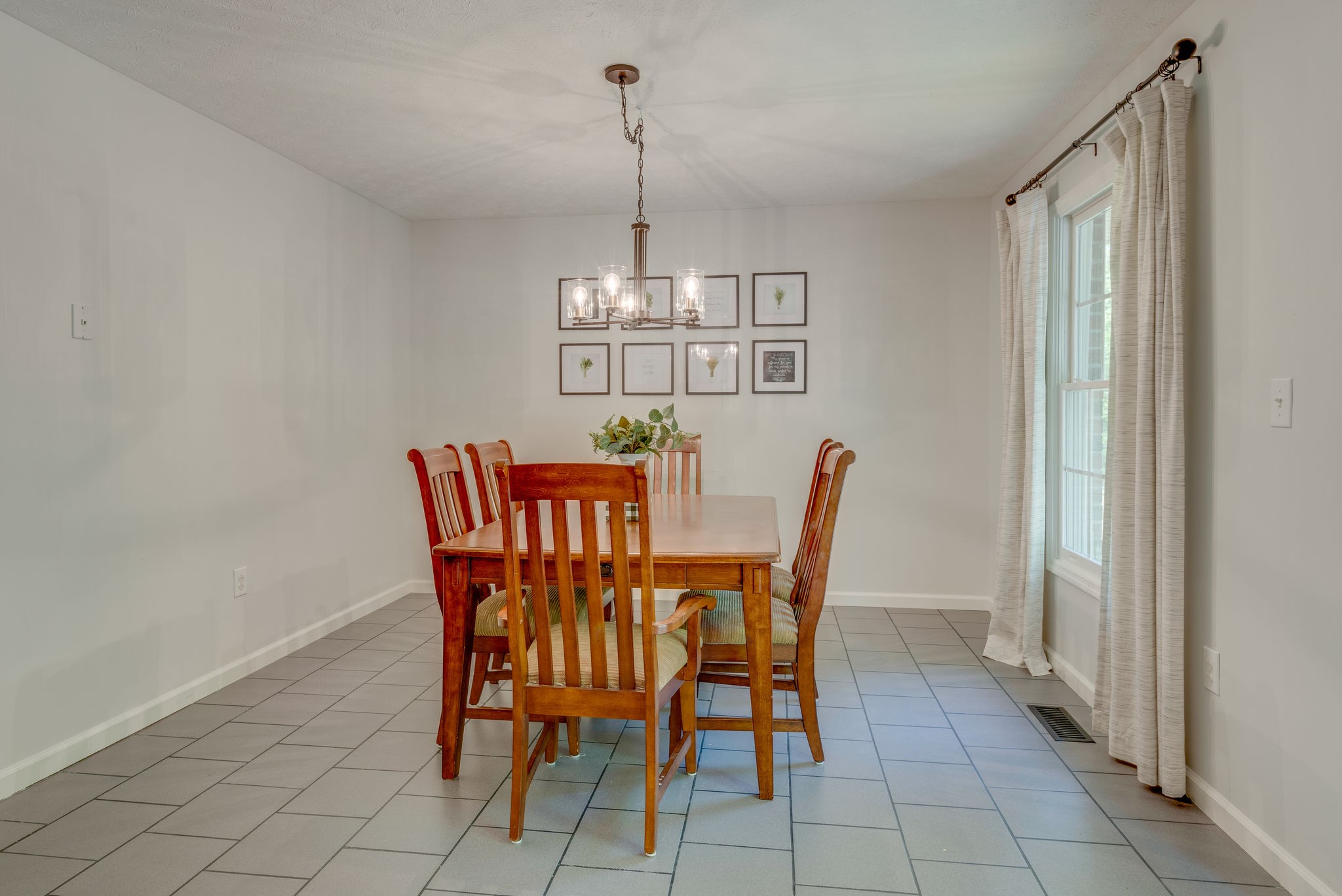 770 Iron Hill Road Burns, TN 37029 - Photo 13 of 28 a view of a dining room with furniture and chandelier