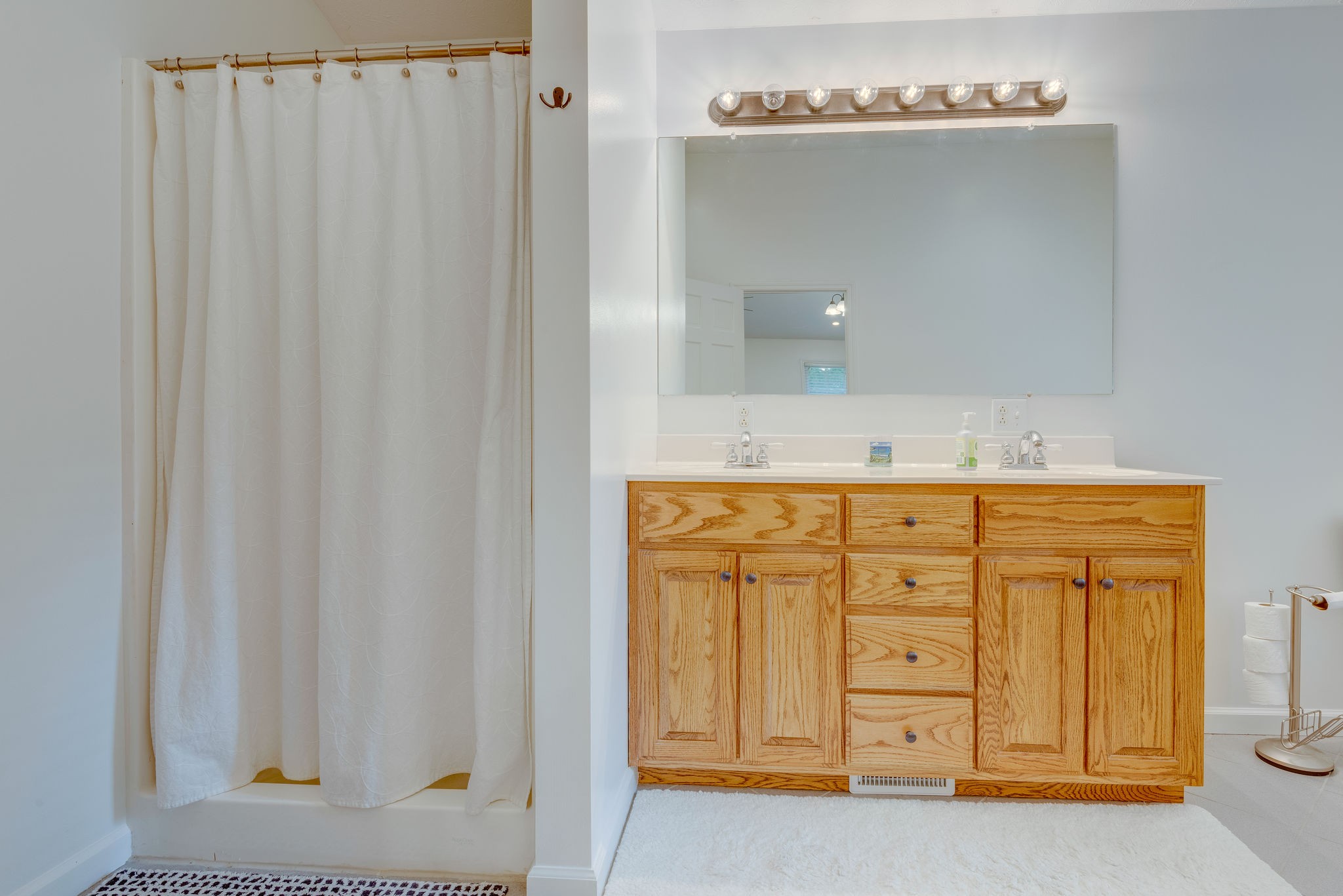 770 Iron Hill Road Burns, TN 37029 - Photo 18 of 28 a bathroom with a granite countertop sink and a mirror