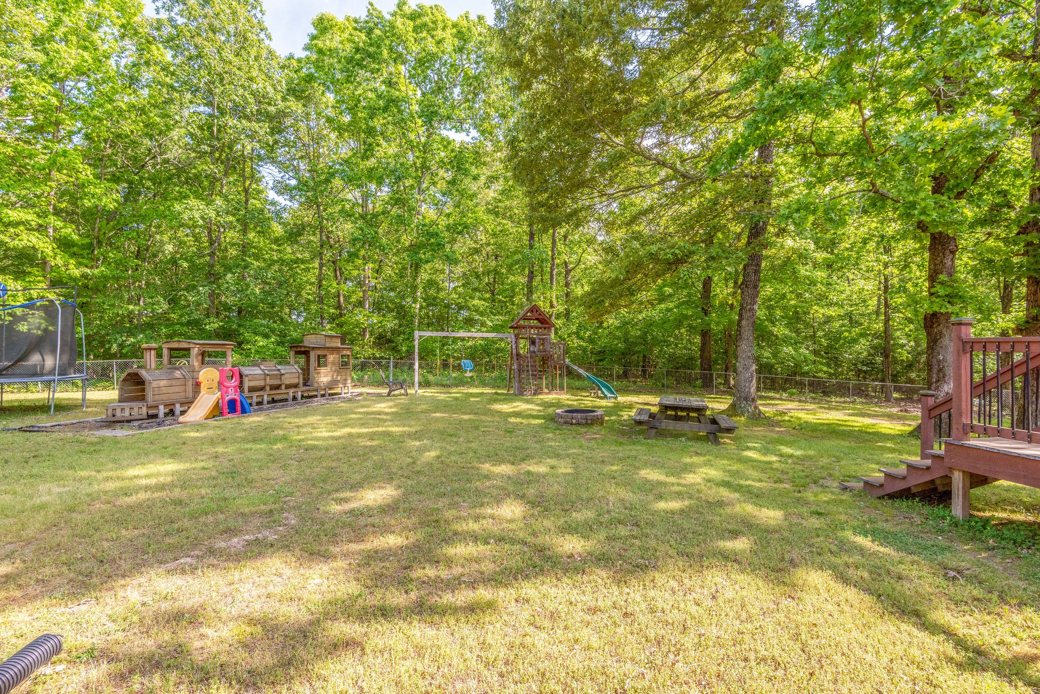 770 Iron Hill Road Burns, TN 37029 - Photo 28 of 28 a view of a swimming pool with a house in the background