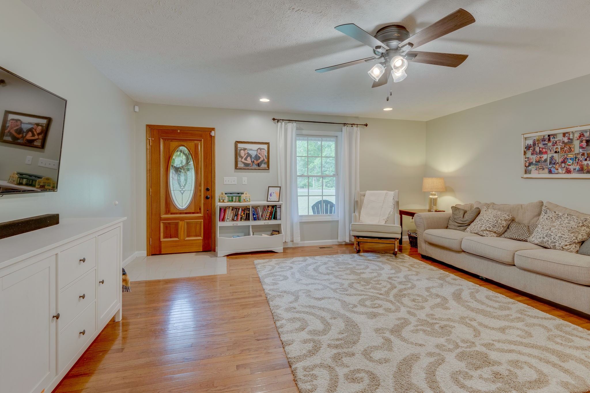 770 Iron Hill Road Burns, TN 37029 - Photo 4 of 28 a living room with furniture and a chandelier