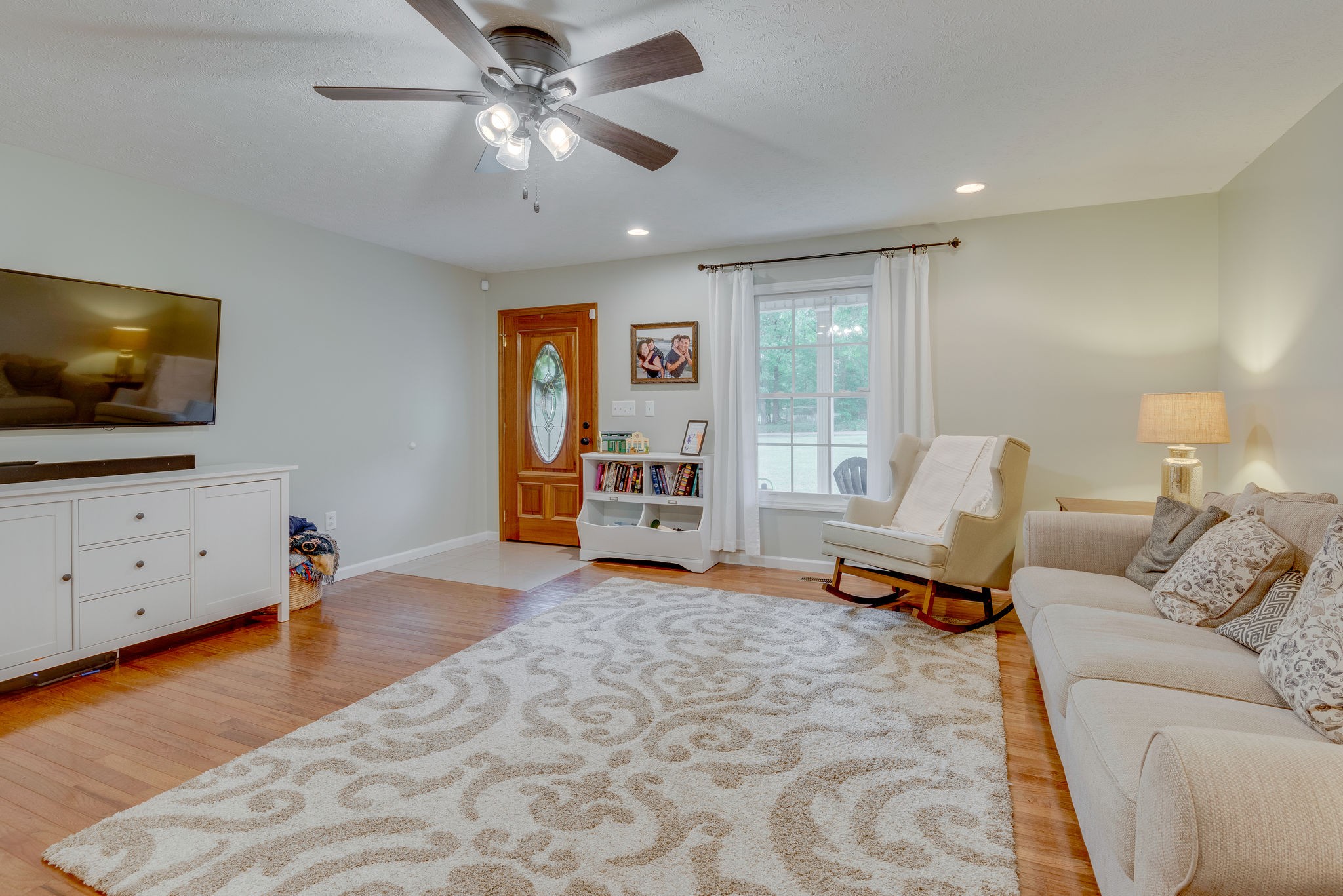 770 Iron Hill Road Burns, TN 37029 - Photo 6 of 28 a living room with furniture and a flat screen tv