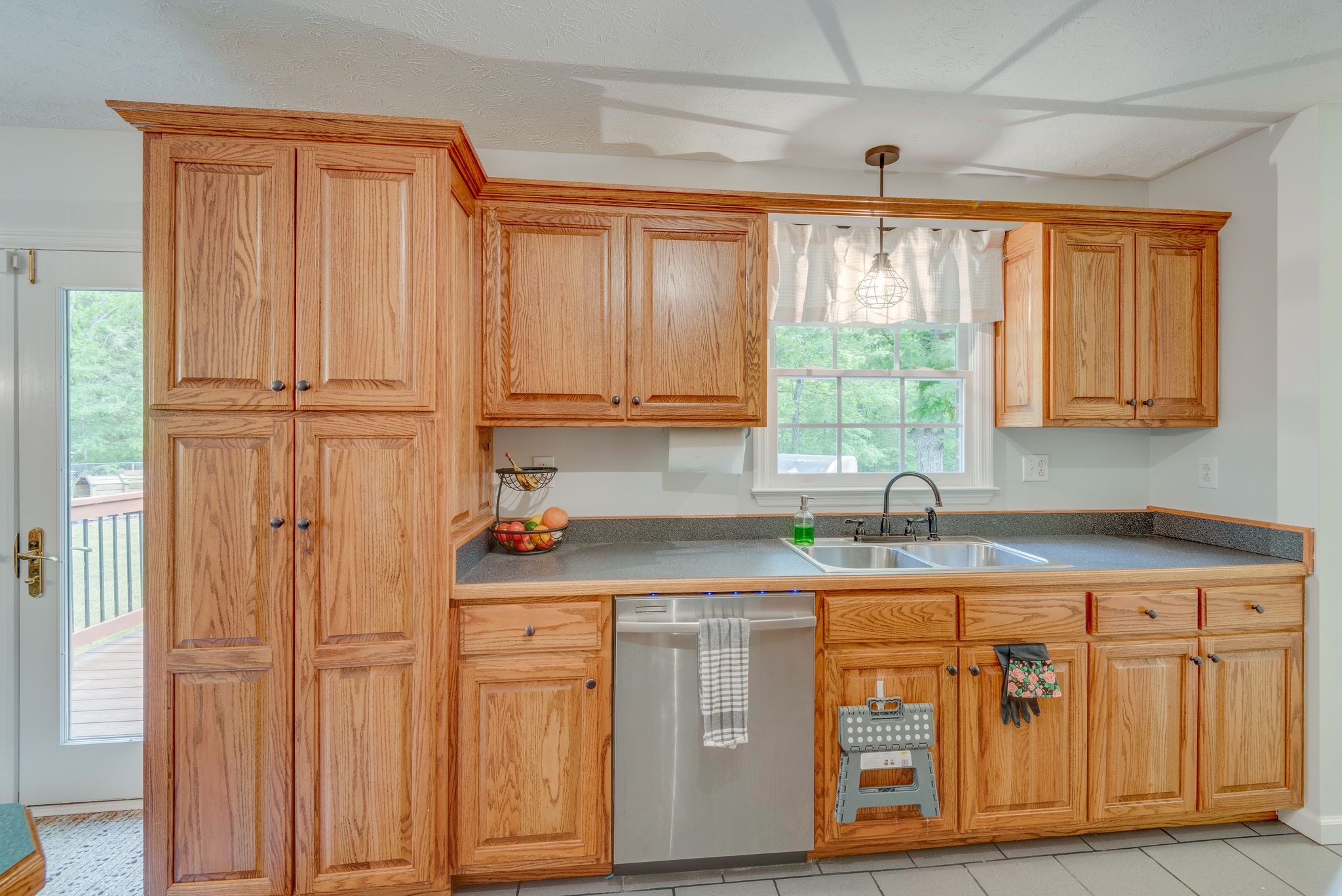 770 Iron Hill Road Burns, TN 37029 - Photo 10 of 28 a kitchen with stainless steel appliances granite countertop cabinets and window