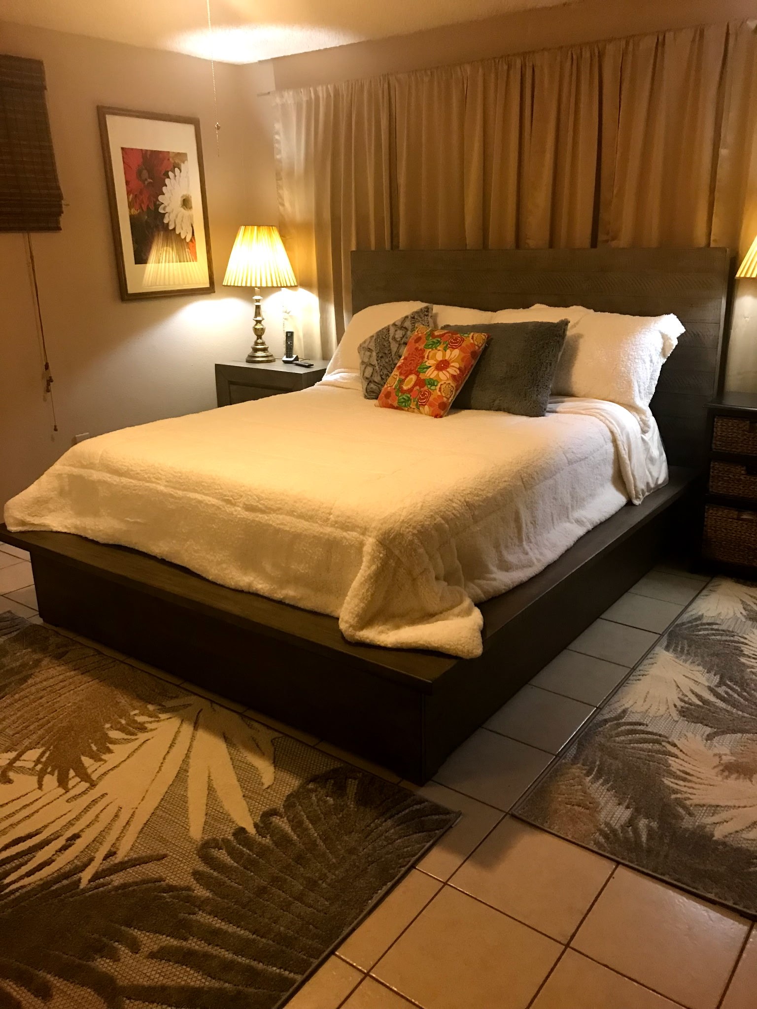 12505 Rollingwood Loop Conroe, TX 77303 - Photo 16 of 24 a bed sitting in a bedroom next to a lamp