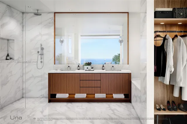 a bathroom with a sink mirror and shower