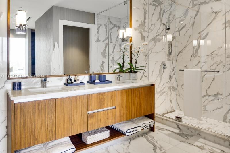 175 Southeast 25th Road, Unit 2802 Miami, FL 33129 - Photo 4 of 32 a bathroom with a sink and a mirror