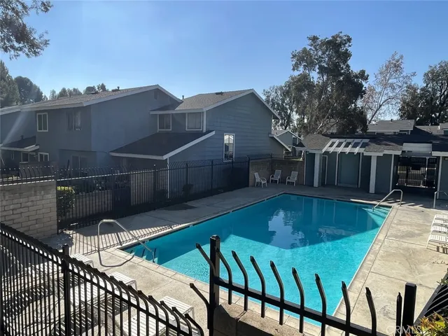 a view of a swimming pool with a patio
