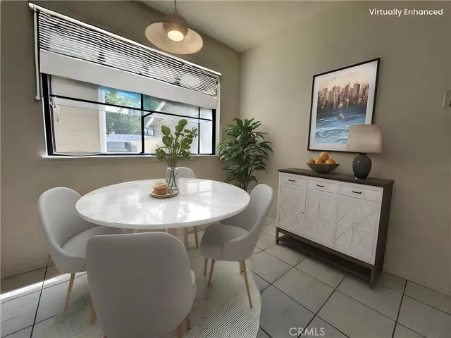a dining room with furniture and window