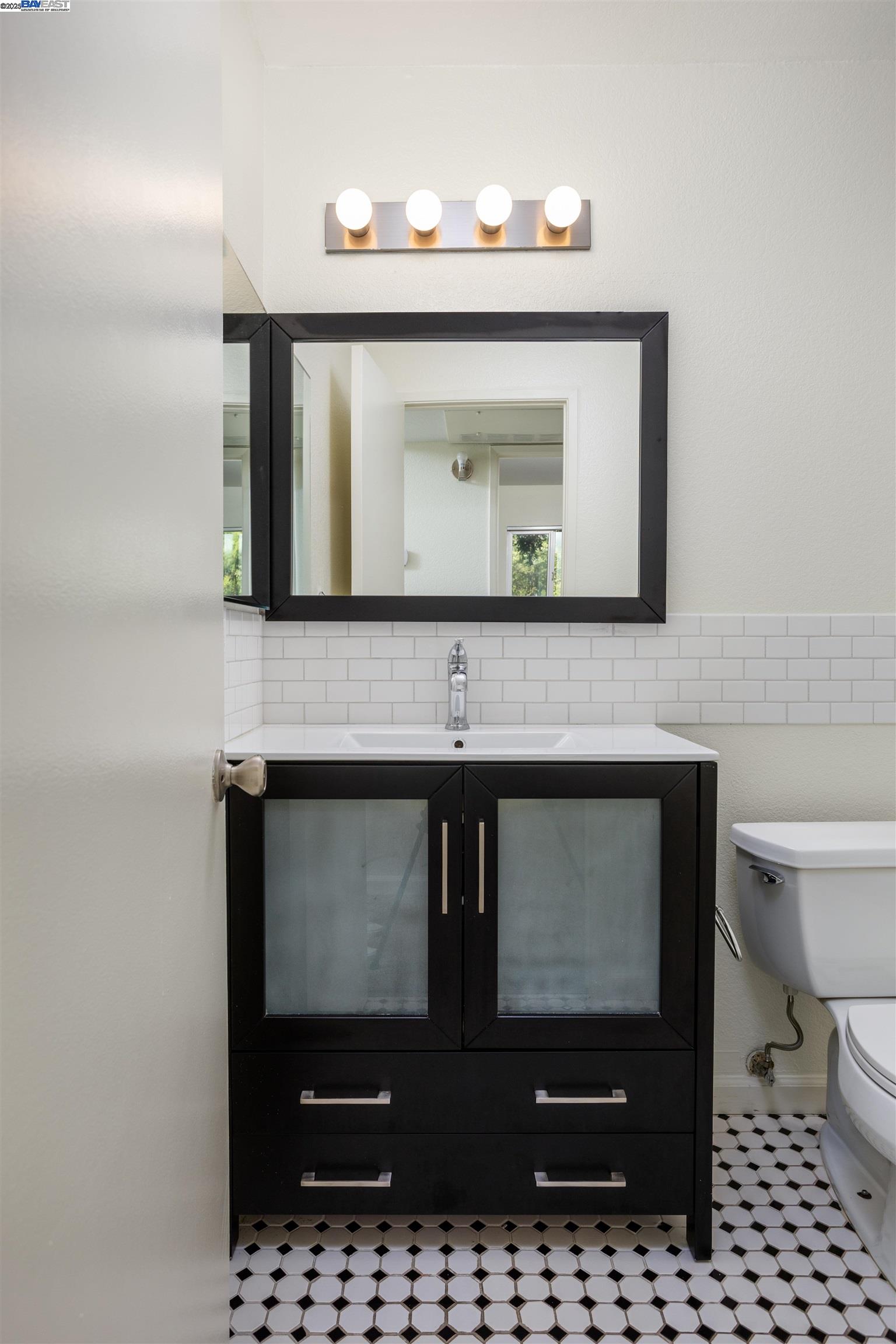 140 Reflections Drive, Unit 24 San Ramon, CA 94583 - Photo 11 of 32 a bathroom with a sink and a mirror