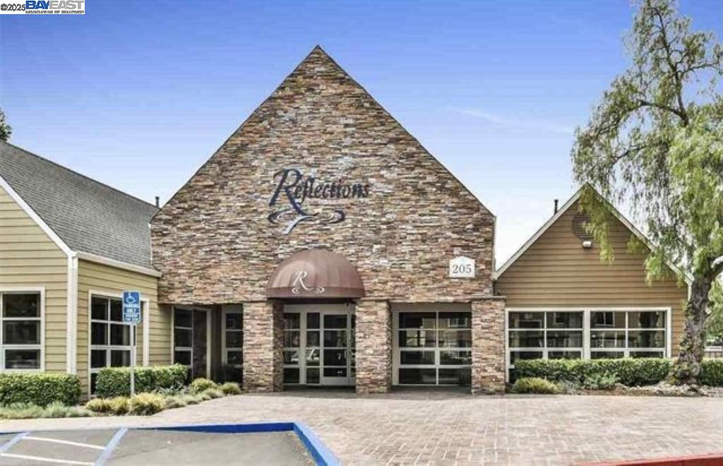 140 Reflections Drive, Unit 24 San Ramon, CA 94583 - Photo 18 of 32 front view of a house with a yard