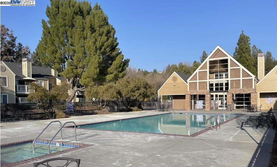 140 Reflections Drive, Unit 24 San Ramon, CA 94583 - Photo 20 of 32 a front view of a house with a yard