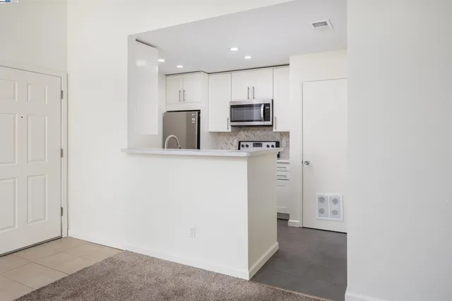a view of a kitchen with a sink