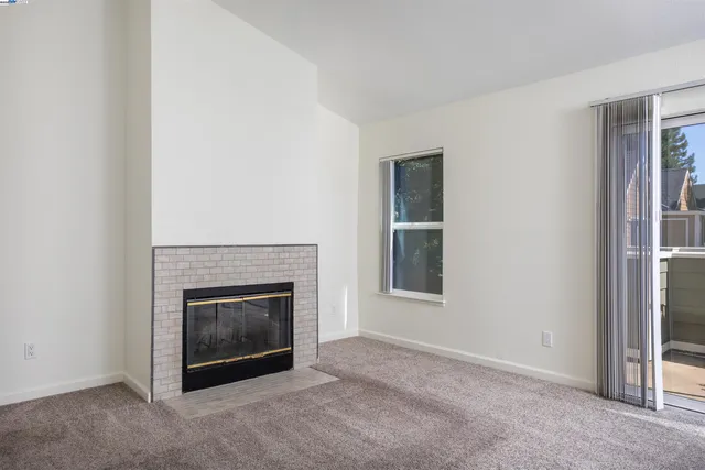 an empty room with a fireplace